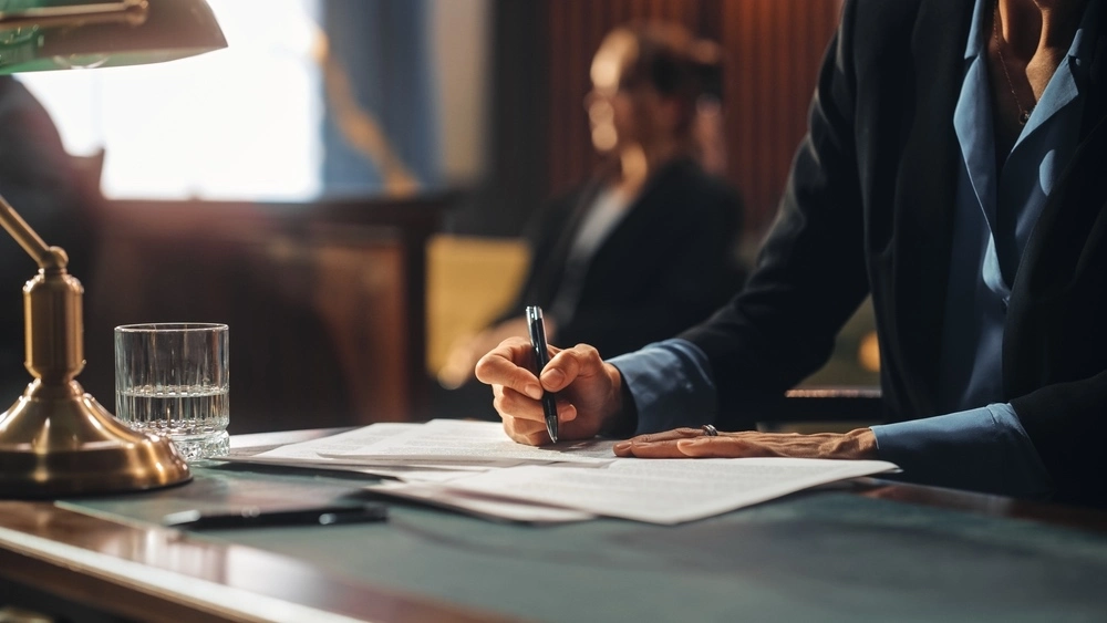 A lawyer and client in a courtroom, representing the need for admission to a substance abuse treatment facility.