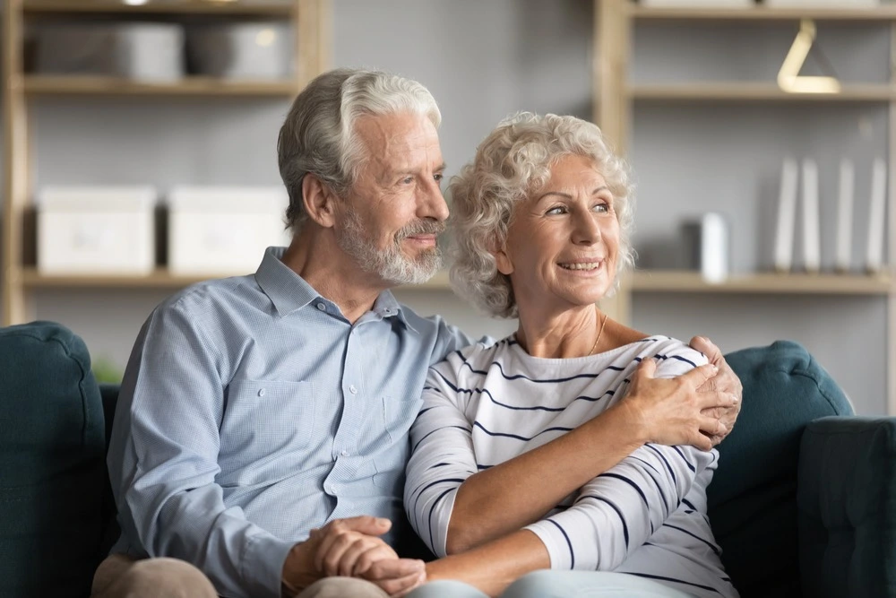 A loving elderly couple shares a comforting hug, symbolizing alternatives to full guardianship in Florida.