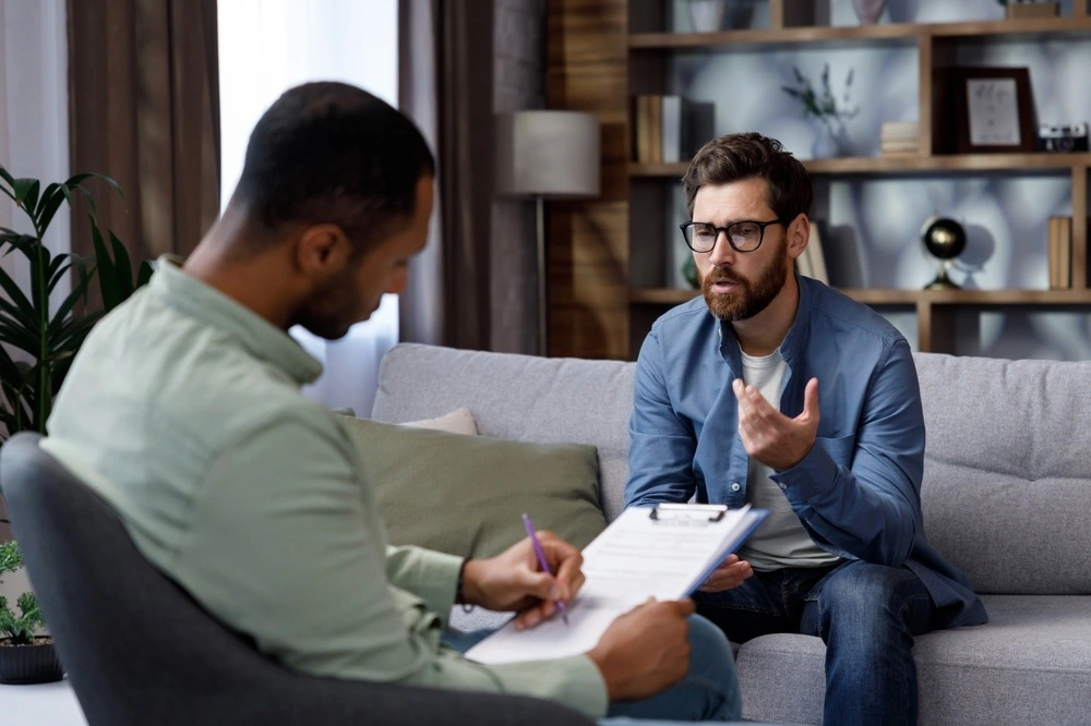 A person in a counseling session, representing how the Marchman Act assists in managing substance abuse cases.