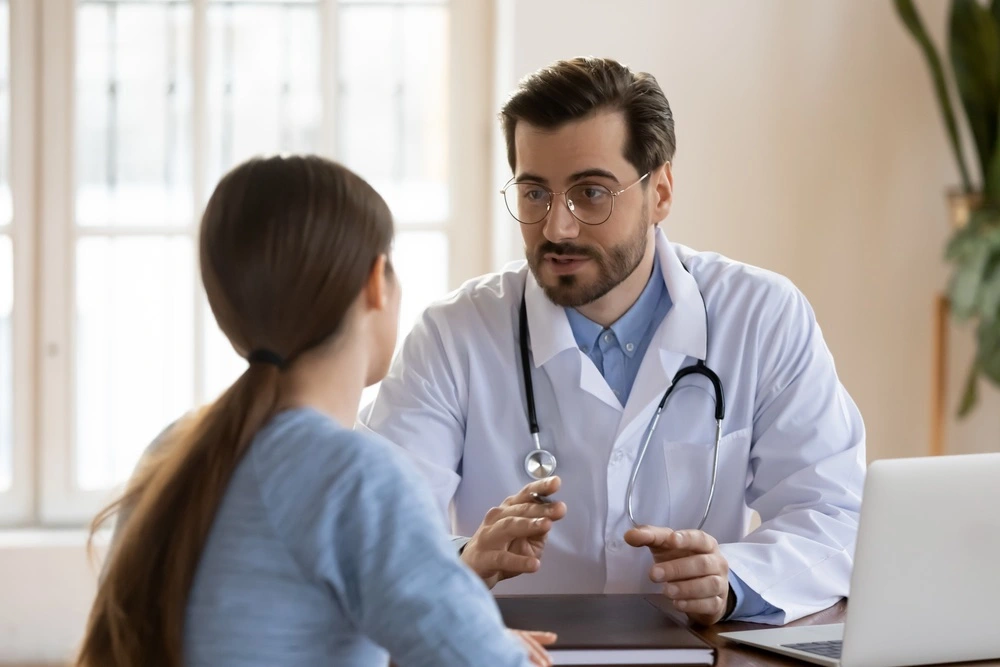 A patient converses with a doctor, representing a person receiving court-ordered treatment