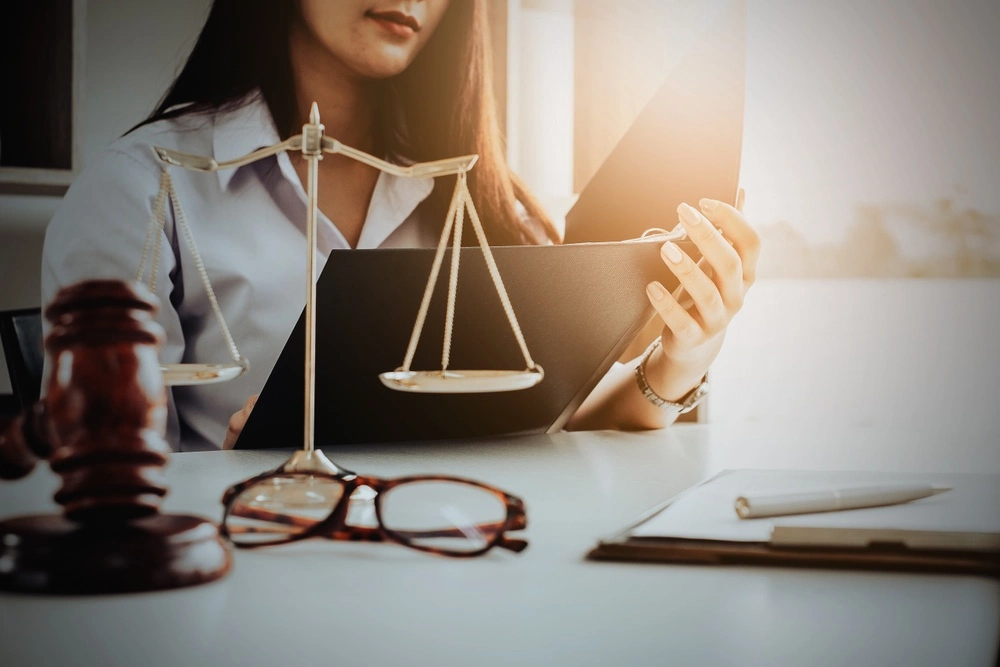 A lawyer sits behind a desk, explaining and comparing the Marchman Act and other laws.